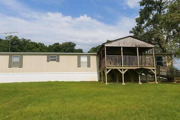 5 Acres of Residential Land with Home for Sale in Gainesville, Texas