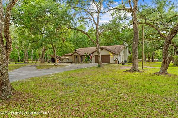 8.3 Acres of Land with Home for Sale in Brooksville, Florida