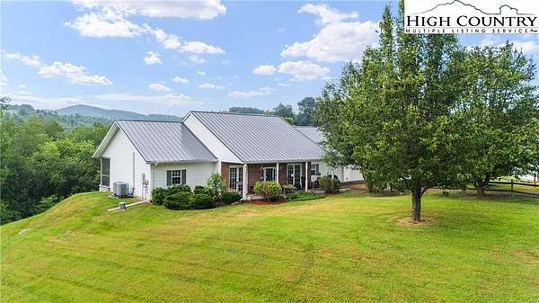 5.55 Acres of Land with Home for Sale in Crumpler, North Carolina