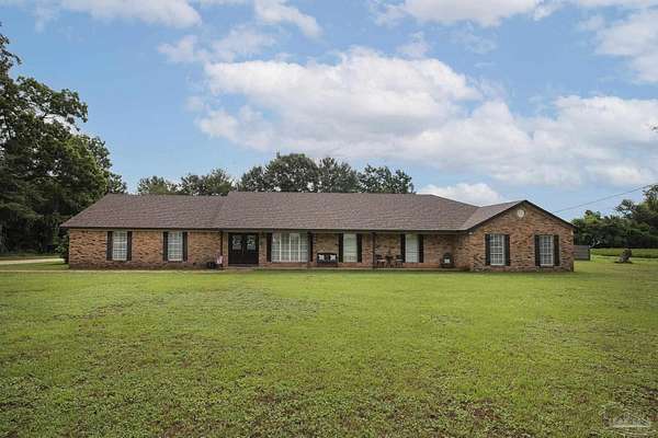 1.5 Acres of Land with Home for Sale in Jay, Florida