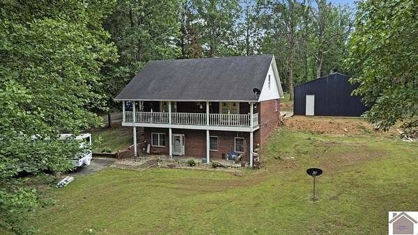 15.6 Acres of Land with Home for Sale in Benton, Kentucky
