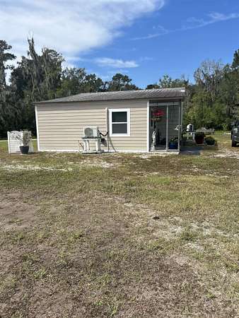 5.6 Acres of Residential Land with Home for Sale in East Palatka, Florida