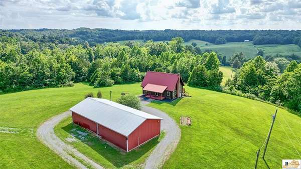23.5 Acres of Land with Home for Sale in Columbia, Kentucky