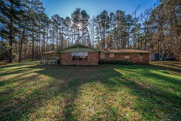 14.2 Acres of Recreational Land with Home for Sale in Winona, Texas