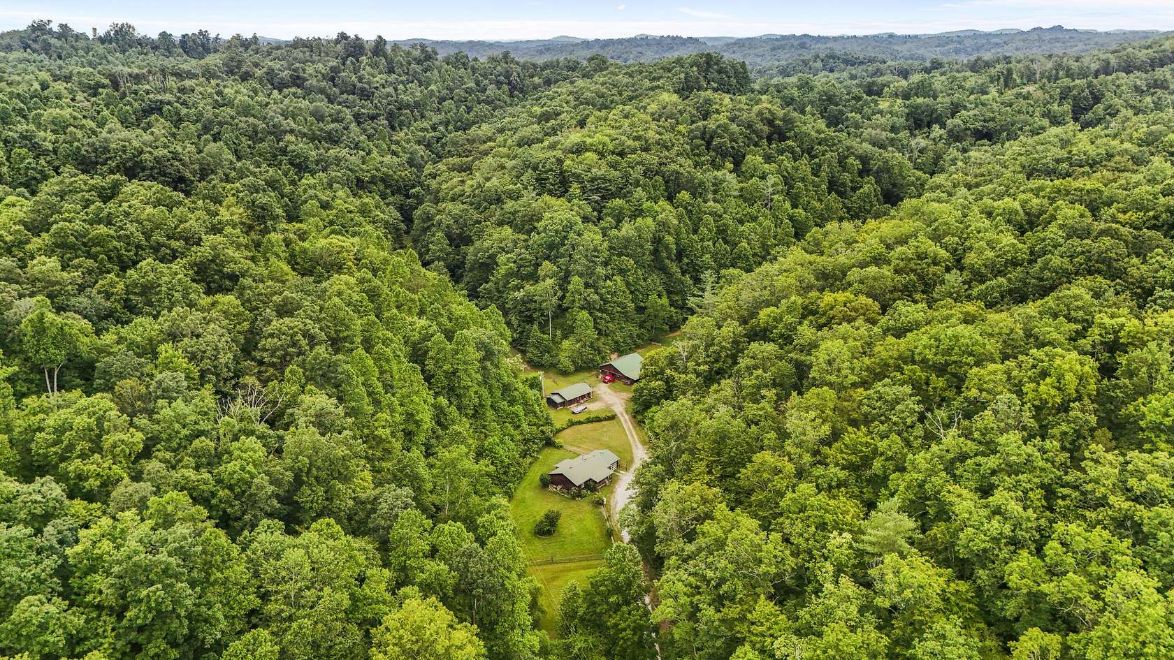 76 Acres of Land with Home for Sale in Salyersville, Kentucky