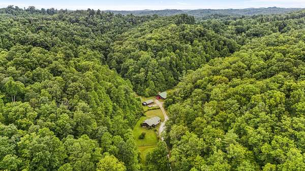 76 Acres of Land with Home for Sale in Salyersville, Kentucky