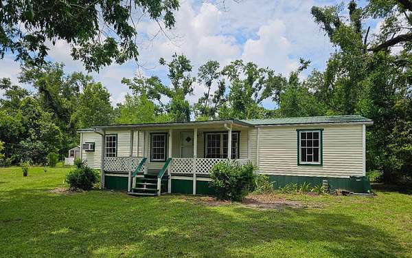 5 Acres of Residential Land with Home for Sale in Mayo, Florida