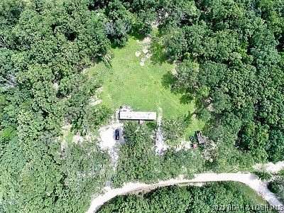 10.5 Acres of Land with Home for Sale in Barnett, Missouri