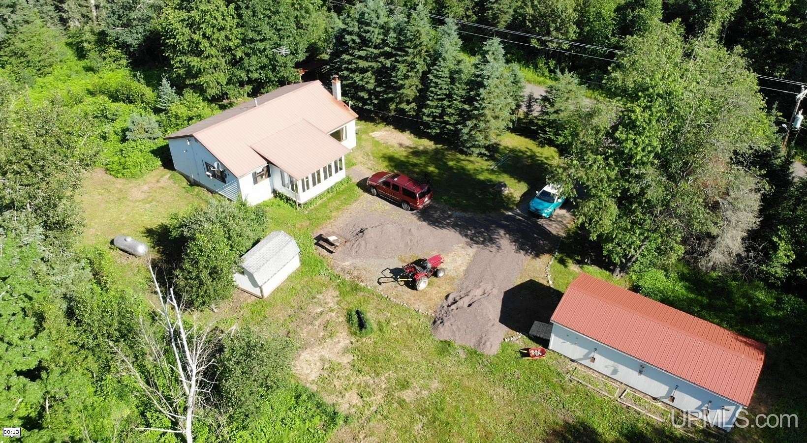 30 Acres of Land with Home for Sale in Trout Creek, Michigan