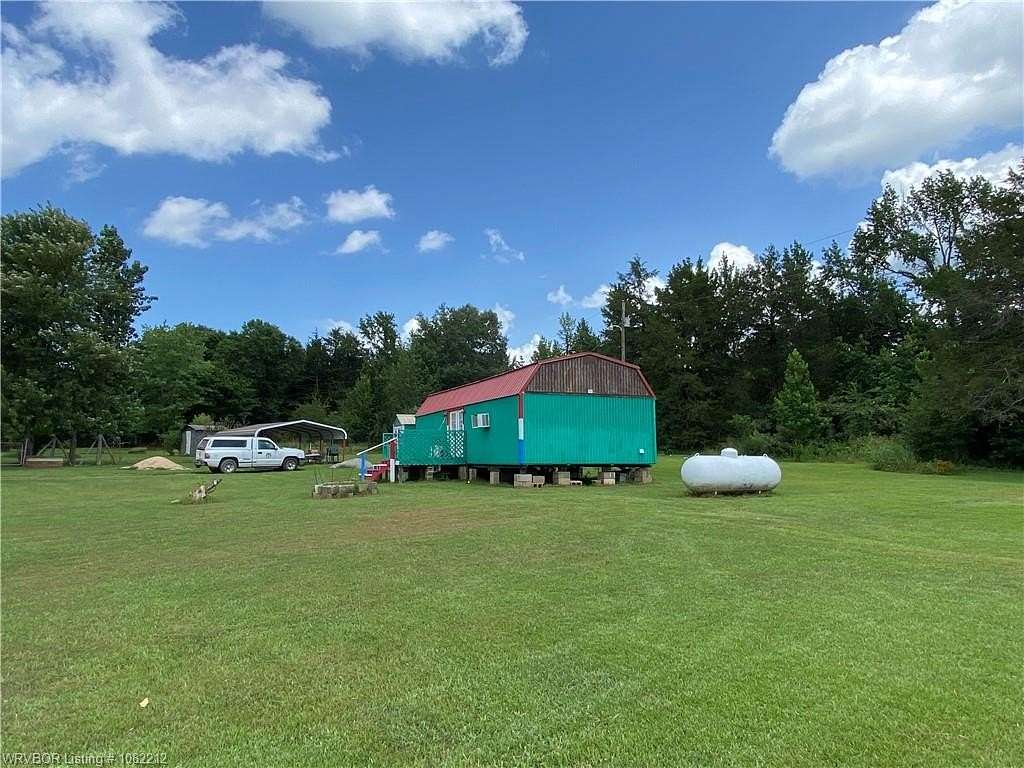 0.9 Acres of Residential Land with Home for Sale in Mulberry, Arkansas