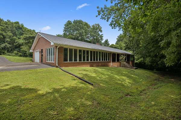 74.7 Acres of Agricultural Land with Home for Sale in Charlotte, Tennessee