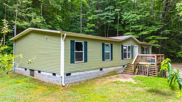 3.5 Acres of Residential Land with Home for Sale in Rocky Top, Tennessee