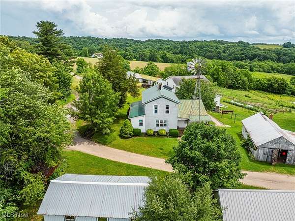 7.62 Acres of Land with Home for Auction in Fresno, Ohio