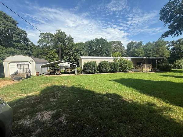 1.6 Acres of Residential Land with Home for Sale in Springville, Tennessee