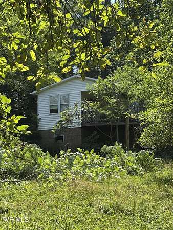 4.66 Acres of Residential Land with Home for Sale in Mountain City, Tennessee