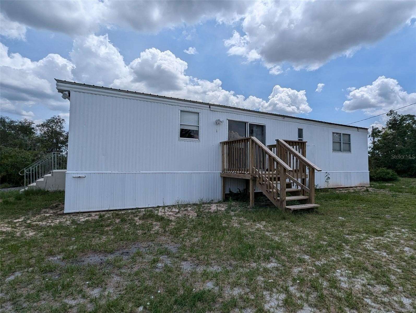 5 Acres of Residential Land with Home for Sale in Avon Park, Florida