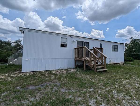 5 Acres of Residential Land with Home for Sale in Avon Park, Florida