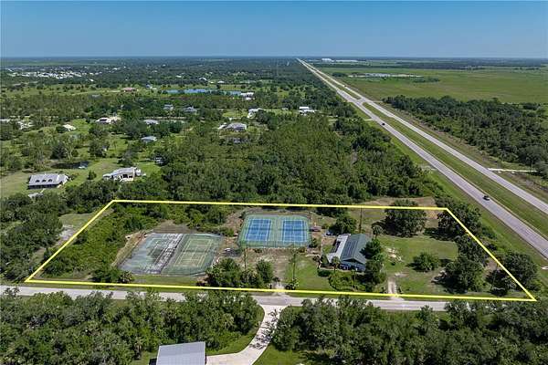 4.59 Acres of Residential Land with Home for Sale in Punta Gorda, Florida