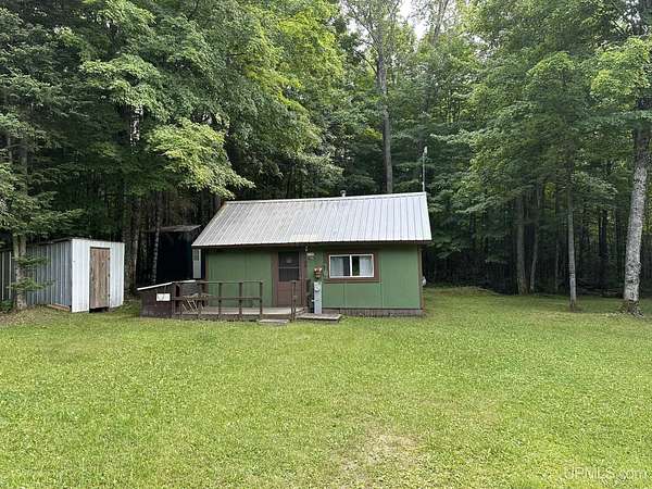 10 Acres of Recreational Land with Home for Sale in Rock, Michigan
