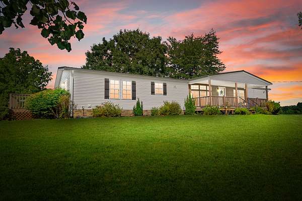 7.9 Acres of Land with Home for Sale in Vanleer, Tennessee