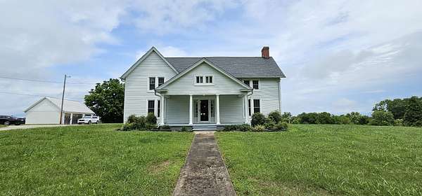 5 Acres of Residential Land with Home for Sale in Cunningham, Tennessee