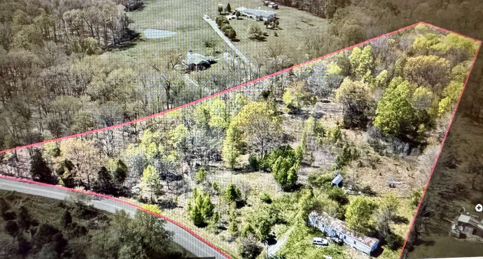 6.8 Acres of Land with Home for Sale in Woodlawn, Tennessee