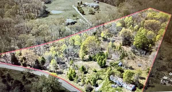 6.8 Acres of Land with Home for Sale in Woodlawn, Tennessee