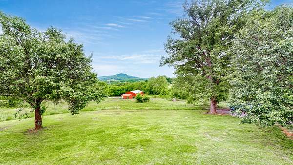 5.4 Acres of Residential Land with Home for Sale in Brush Creek, Tennessee