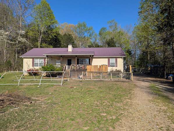 11.8 Acres of Land with Home for Sale in Palmyra, Tennessee