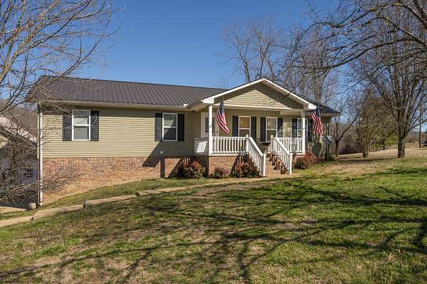 32.4 Acres of Agricultural Land with Home for Sale in Hohenwald, Tennessee