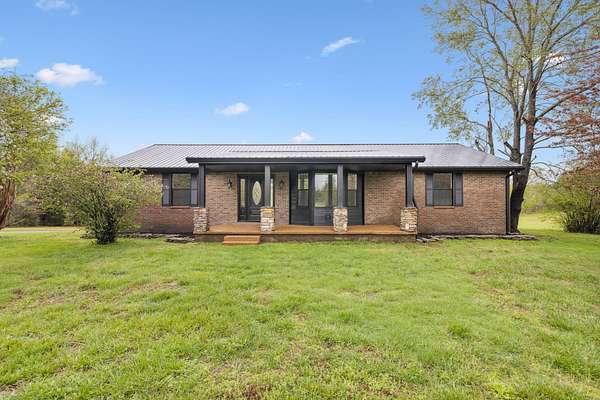 5 Acres of Residential Land with Home for Sale in Bon Aqua, Tennessee