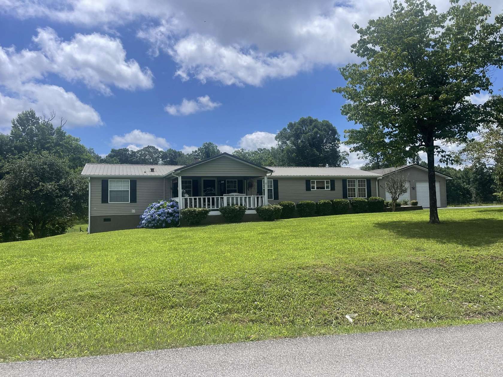 1.5 Acres of Residential Land with Home for Sale in Riceville, Tennessee