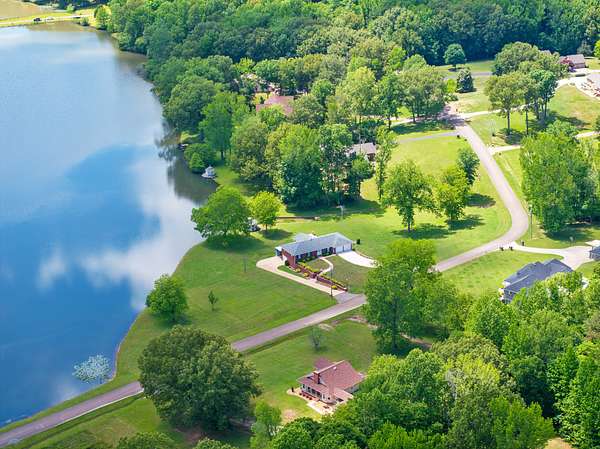 2 Acres of Residential Land with Home for Sale in Camden, Tennessee