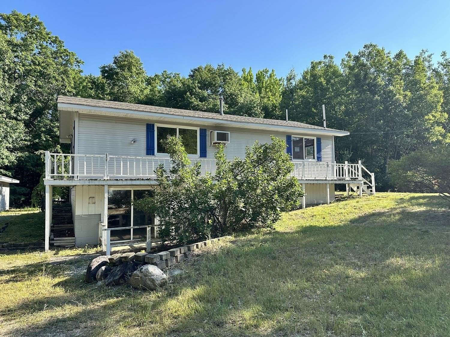 10.7 Acres of Land with Home for Sale in Lupton, Michigan