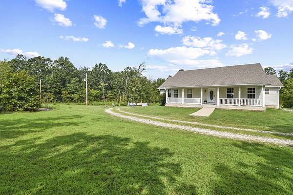 9.4 Acres of Residential Land with Home for Sale in Hartville, Missouri