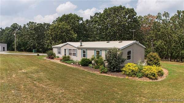 74 Acres of Agricultural Land with Home for Sale in Edwards, Missouri