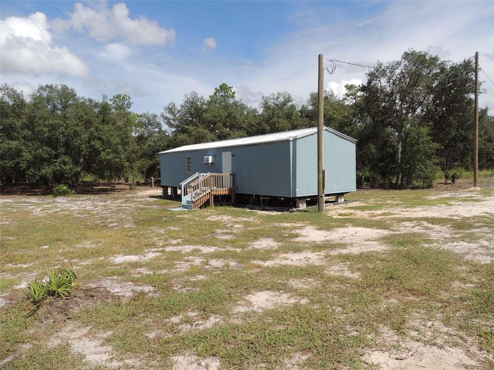 2.5 Acres of Residential Land with Home for Sale in Bronson, Florida