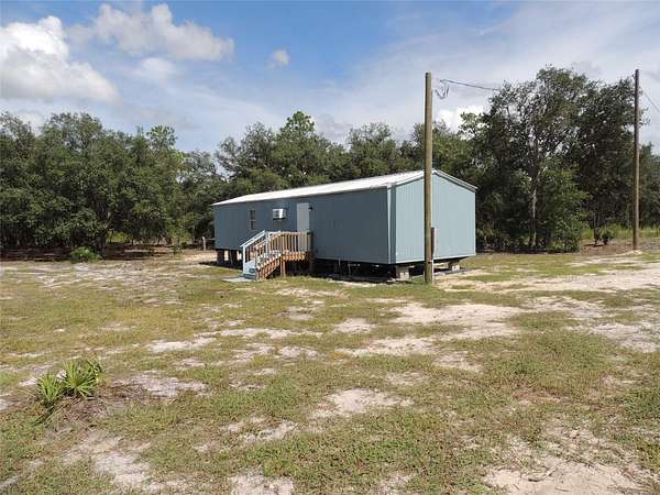 2.5 Acres of Residential Land with Home for Sale in Bronson, Florida