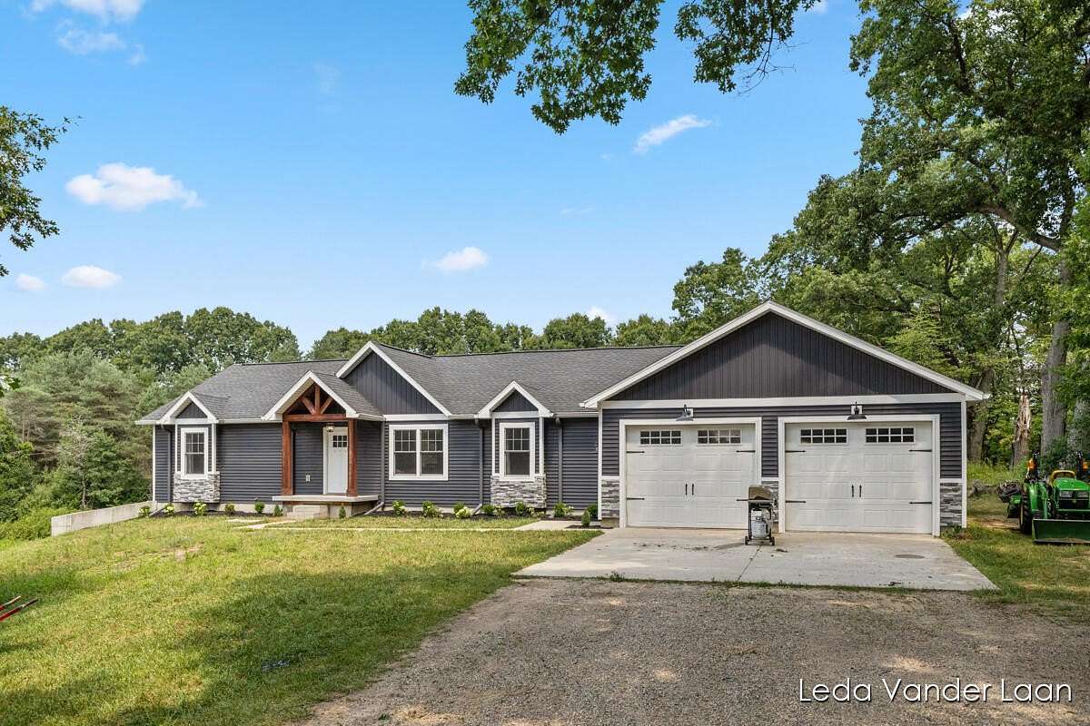 3.5 Acres of Residential Land with Home for Sale in Rockford, Michigan