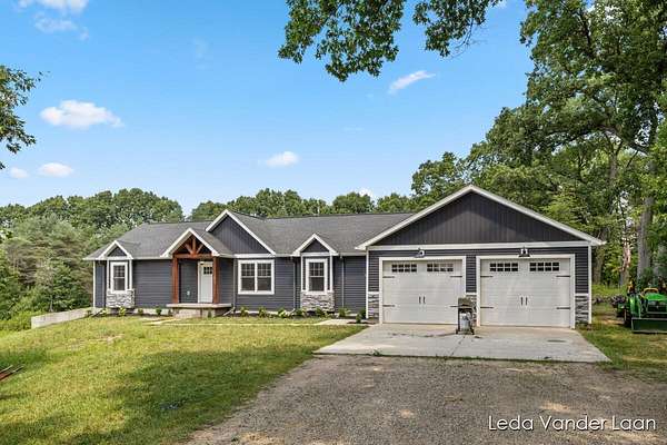 3.5 Acres of Residential Land with Home for Sale in Rockford, Michigan