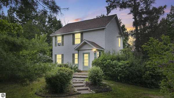 2.79 Acres of Residential Land with Home for Sale in Central Lake, Michigan