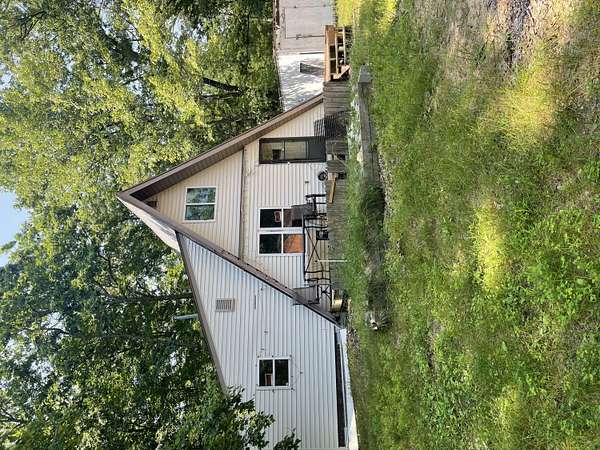 20.3 Acres of Recreational Land with Home for Sale in Irons, Michigan