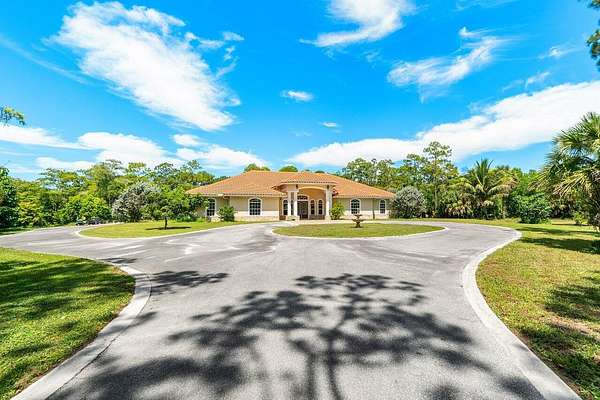 5 Acres of Residential Land with Home for Sale in The Acreage, Florida