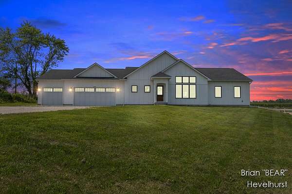 2.5 Acres of Residential Land with Home for Sale in Alto, Michigan