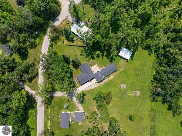 2.8 Acres of Residential Land with Home for Sale in Alanson, Michigan