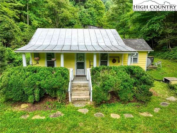 16.3 Acres of Land with Home for Sale in Lansing, North Carolina