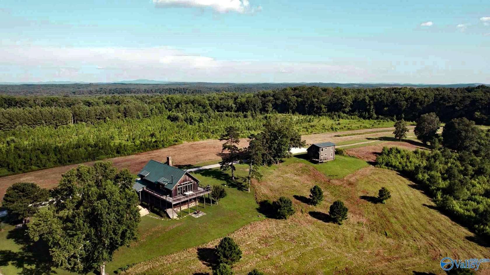910 Acres of Recreational Land with Home for Sale in Pell City, Alabama