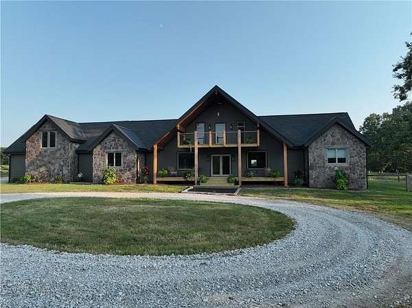 11.6 Acres of Recreational Land with Home for Sale in Gravette, Arkansas