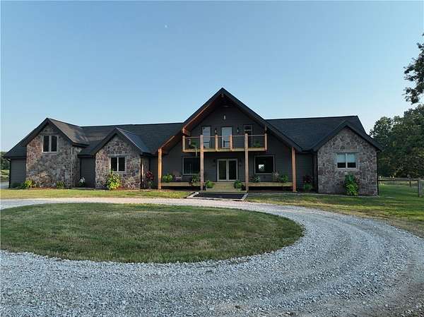 11.6 Acres of Recreational Land with Home for Sale in Gravette, Arkansas