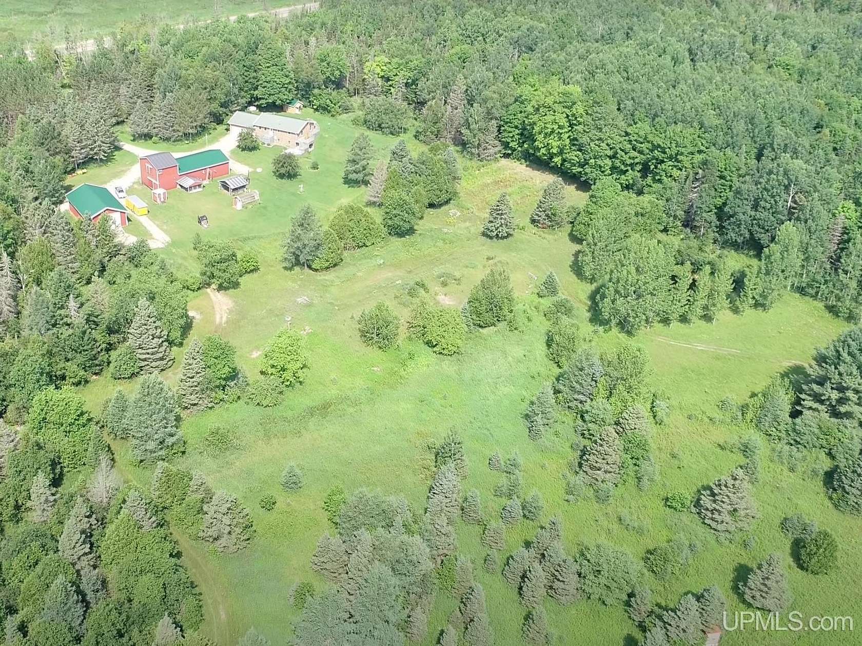 100 Acres of Land with Home for Sale in Chatham, Michigan